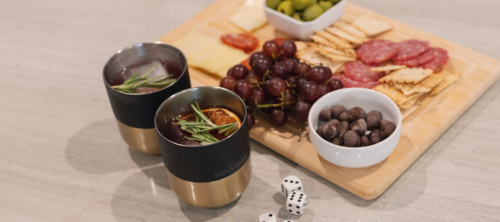 Black and gold tumbler with cocktails